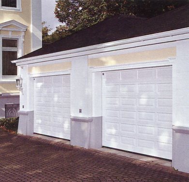 Picture of a pair of Hormann Hemlock sectional garage doors finished in white